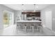 Modern kitchen with an island, stainless steel appliances, and white cabinets at 16125 Magpie Rd, Weeki Wachee, FL 34614