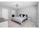 Main bedroom with a king-size bed, carpet flooring, and ensuite bathroom at 16125 Magpie Rd, Weeki Wachee, FL 34614