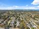 Wide aerial view of the neighborhood, showing proximity to the water at 1695 Honeybear Ln, Dunedin, FL 34698