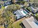 Aerial view highlighting the home's pool and large backyard at 1695 Honeybear Ln, Dunedin, FL 34698