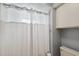 Clean bathroom with shower and white curtains at 1695 Honeybear Ln, Dunedin, FL 34698