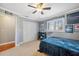 Bedroom with closet, double bed, and car themed decor at 1695 Honeybear Ln, Dunedin, FL 34698