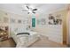 Bedroom with a floral bedspread, dresser, and window at 1695 Honeybear Ln, Dunedin, FL 34698