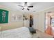 Bedroom with bed, closet, and window with shutters at 1695 Honeybear Ln, Dunedin, FL 34698