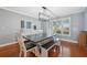 Charming dining area with a farmhouse style table and bench at 1695 Honeybear Ln, Dunedin, FL 34698