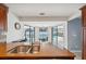 Kitchen with granite countertop, stainless steel sink, and pool view through sliding doors at 1695 Honeybear Ln, Dunedin, FL 34698