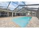 Inviting screened pool area, perfect for outdoor entertaining at 1695 Honeybear Ln, Dunedin, FL 34698