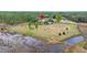 Aerial view showing house location on large lot near pond at 18010 Okeene Dr, Hudson, FL 34667