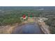 Aerial view of property showing house and pond at 18010 Okeene Dr, Hudson, FL 34667