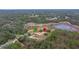 Wide aerial view of property showing house and pond at 18010 Okeene Dr, Hudson, FL 34667