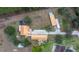 Aerial view of house, detached garage, and large lot at 18010 Okeene Dr, Hudson, FL 34667