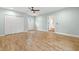 Bedroom with wood-look floors and access to exterior at 18010 Okeene Dr, Hudson, FL 34667