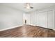 Light and airy bedroom with wood-look floors and white doors at 18010 Okeene Dr, Hudson, FL 34667