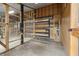 Interior view of a chicken coop with wire cages at 18010 Okeene Dr, Hudson, FL 34667