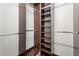 Large walk-in closet with custom shelving and hanging rods at 18010 Okeene Dr, Hudson, FL 34667