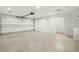 Spacious garage with ample storage shelving and a separate closet at 18010 Okeene Dr, Hudson, FL 34667