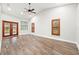 Spacious living room featuring hardwood floors and a neutral color palette at 18010 Okeene Dr, Hudson, FL 34667