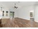 Bright and spacious living room with hardwood floors and high ceilings at 18010 Okeene Dr, Hudson, FL 34667