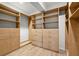 Large walk-in closet with ample shelving and drawers at 18010 Okeene Dr, Hudson, FL 34667