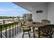 Balcony with table and chairs, water view at 19111 Vista Bay Dr # 304, Indian Shores, FL 33785