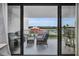 Balcony with patio furniture and water view at 19111 Vista Bay Dr # 304, Indian Shores, FL 33785