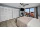 Bright bedroom with water view, ceiling fan, and ample closet space at 19111 Vista Bay Dr # 304, Indian Shores, FL 33785