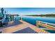 Spacious wooden community dock with seating and water views at 19111 Vista Bay Dr # 304, Indian Shores, FL 33785