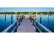 Wooden community dock extending over calm water at 19111 Vista Bay Dr # 304, Indian Shores, FL 33785