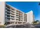 Condo building exterior showcasing multiple floors, balconies, and parking at 19111 Vista Bay Dr # 304, Indian Shores, FL 33785