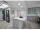 Modern kitchen with gray cabinets, quartz countertops, and stainless steel appliances at 19111 Vista Bay Dr # 304, Indian Shores, FL 33785