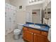 Simple bathroom with shower/tub combo, toilet, and vanity at 1933 Sterling Glen Ct, Sun City Center, FL 33573