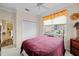 Cozy bedroom with double bed, built-in closet and window at 1933 Sterling Glen Ct, Sun City Center, FL 33573