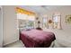 Cozy bedroom with a double bed and plenty of natural light at 1933 Sterling Glen Ct, Sun City Center, FL 33573