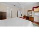 Main bedroom with hardwood floors, a ceiling fan and built-in dresser at 1933 Sterling Glen Ct, Sun City Center, FL 33573