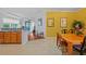 Charming dining area with wood table and chairs, adjacent to the kitchen at 1933 Sterling Glen Ct, Sun City Center, FL 33573