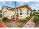 Well-maintained single-story home with attached garage and landscaped walkway at 1933 Sterling Glen Ct, Sun City Center, FL 33573