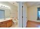 Bathroom with vanity, toilet, and tub/shower combo at 1950 Sterling Glen Ct, Sun City Center, FL 33573