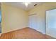 Bedroom with double-door closet and laminate flooring at 1950 Sterling Glen Ct, Sun City Center, FL 33573