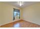 Bright bedroom with laminate wood flooring and ceiling fan at 1950 Sterling Glen Ct, Sun City Center, FL 33573