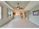 Bright dining room with tile floors and a view to the kitchen at 1950 Sterling Glen Ct, Sun City Center, FL 33573