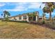 House exterior showing a side view with landscaping and lawn at 1950 Sterling Glen Ct, Sun City Center, FL 33573