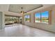 Bright Gathering room with water views and sliding doors to patio at 1950 Sterling Glen Ct, Sun City Center, FL 33573