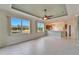 Bright Gathering room with kitchen access and water views at 1950 Sterling Glen Ct, Sun City Center, FL 33573