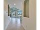 Spacious hallway with tiled floor and access to living area at 1950 Sterling Glen Ct, Sun City Center, FL 33573