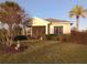 Single-story house with screened porch and landscaping at 1950 Sterling Glen Ct, Sun City Center, FL 33573