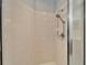 Clean shower with tile surround and handheld showerhead at 1950 Sterling Glen Ct, Sun City Center, FL 33573