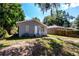 House with a large backyard and mature trees at 2002 E Ellicott St, Tampa, FL 33610