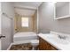 Updated bathroom with tub and vanity at 2002 E Ellicott St, Tampa, FL 33610