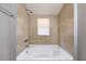 Clean bathroom with a built-in bathtub at 2002 E Ellicott St, Tampa, FL 33610