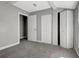 Spacious bedroom with double closets and neutral decor at 2002 E Ellicott St, Tampa, FL 33610